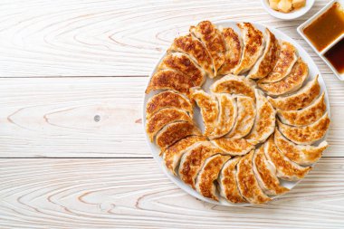 fried gyoza or dumplings snack with soy sauce