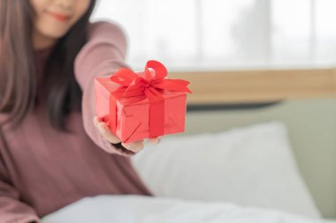 Asian women happy to receive a gift box