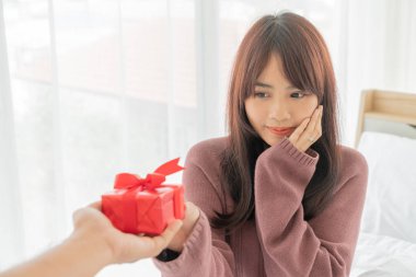 Asian women happy to receive a gift box