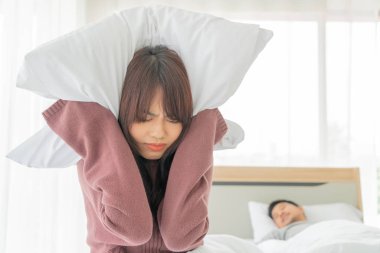 The Asian wife have problems with snoring husband