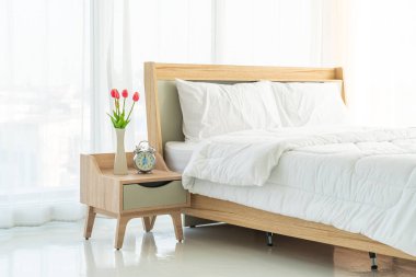 white comfortable pillow on bed decoration in bedroom