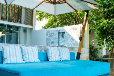 empty outdoor patio chair and desk on balcony