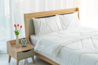 white comfortable pillow on bed decoration in bedroom