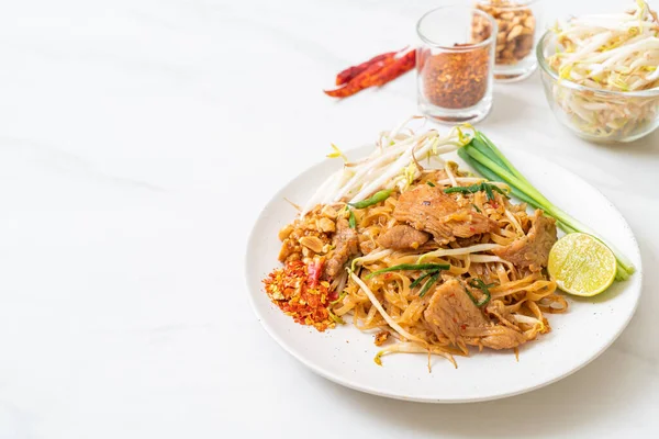 stir-fried rice noodles with pork in Asian style