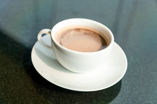 hot chocolate or cocoa cup on table in cafe restaurant