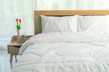 white comfortable pillow on bed decoration in bedroom