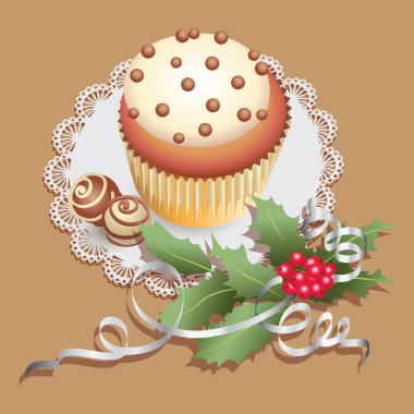 Kek çikolata tatlılar ve holly Noel dalı ile. 