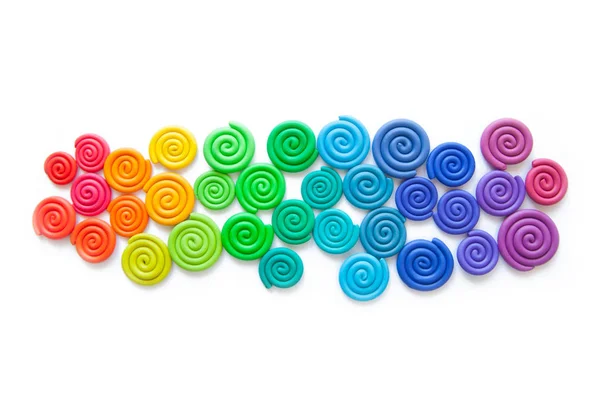 Sfondo di plastilina. spirali colorate torte di plastica di — Foto Stock