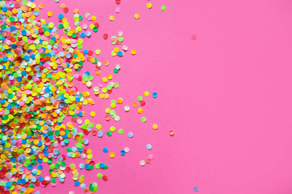 Frame made of colored confetti. Pink background. — Stock Photo, Image