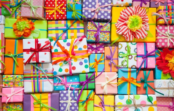 Colored gift boxes with colorful ribbons. White background. Gift