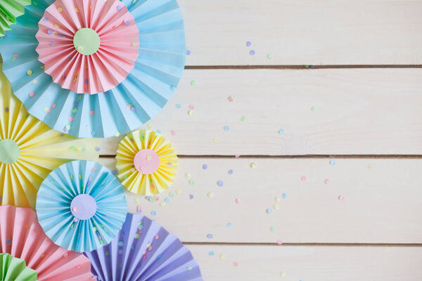 Colorful bright pastel paper rosette. Decorating for a party.