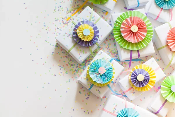 Boxes for gifts of white color. Colored satin ribbons. White bac Stock Image