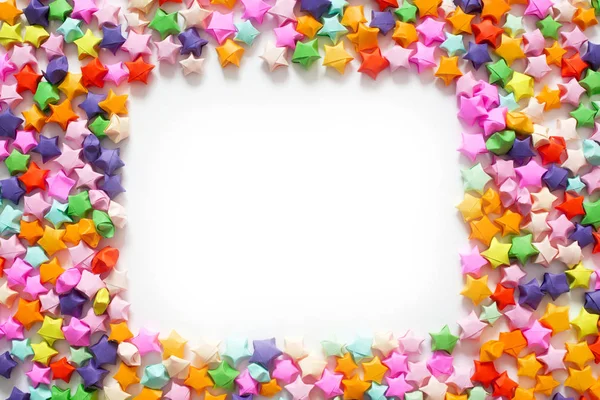 Renkli katlanmış kağıt yıldız veya çerçeve olarak kullanmak için origami şans yıldızı