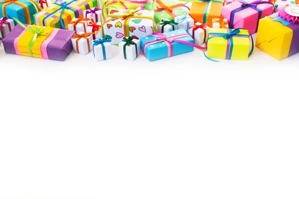 Colored gift boxes with colorful ribbons. White background. Gift — Stock Photo, Image