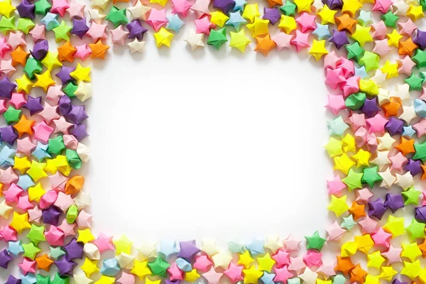 Renkli katlanmış kağıt yıldız veya çerçeve olarak kullanmak için origami şans yıldızı