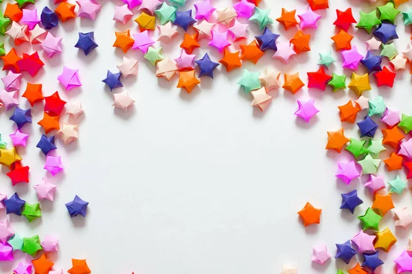 Renkli katlanmış kağıt yıldız veya çerçeve olarak kullanmak için origami şans yıldızı