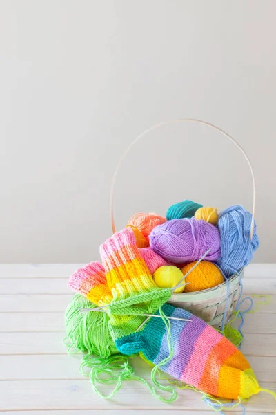 Closeup of basket with colorful yarn clews. Concept of freelance — Stock Photo, Image