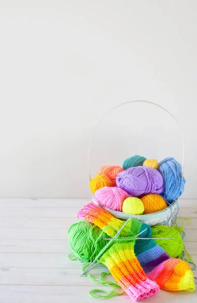 Closeup of basket with colorful yarn clews. Concept of freelance — Stock Photo, Image