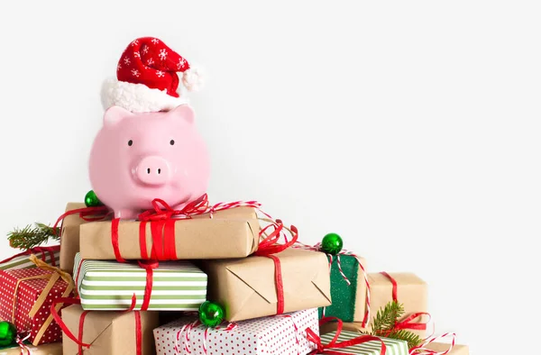 Piggy bank in santa claus hat. Christmas gift boxes. White backg — 스톡 사진