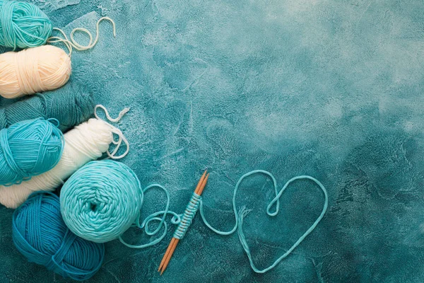 Yarn for knitting mint, blue, green, turquoise and knitting need — Stock Photo, Image