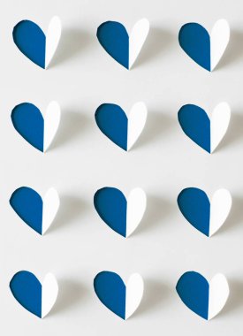 Classic Blue. Color of the Year 2020. Hearts cut out of white pa clipart