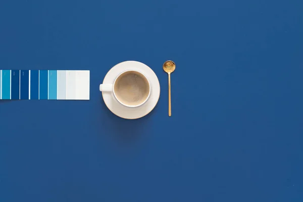 Classic Blue. Color of the Year 2020. Top view of workspace with — Stock Photo, Image