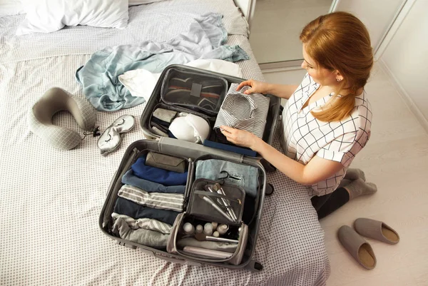 Female Hands Packing Traveler Case Bed Closeup Beach Accessories Opened — Stock Photo, Image