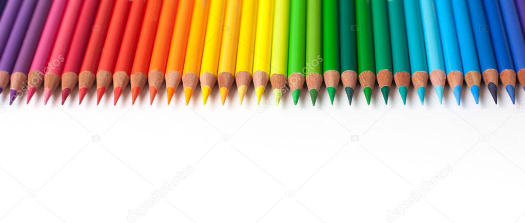 Crayons - colored pencil set loosely arranged  on white background. colored pencils arranged exactly in a row.