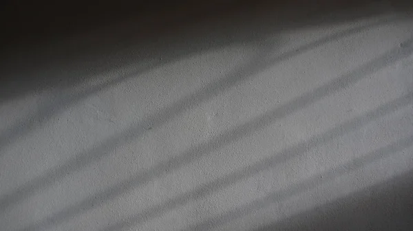 Sombras projetadas em uma parede de gesso — Fotografia de Stock