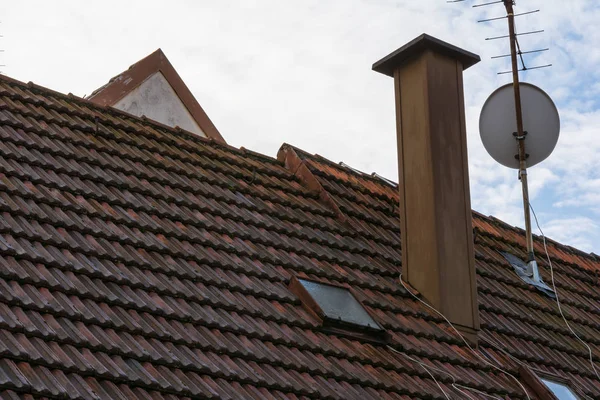 European Orange Roof Tiles Chimney Satellite Dish Residential Ro — Stock Photo, Image