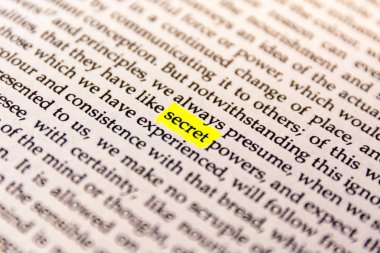 Book Highlighted Word  with Yellow Fluorescent Marker  -  Secret