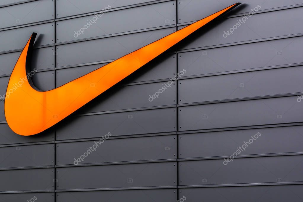 Nike Swoosh Logo at Metzingen Outlet Shopping Complex in Germany, Europe on November 1, 2017