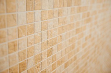 Duvarlar için dekoratif bej kare döşeme ve banyoda zemin.