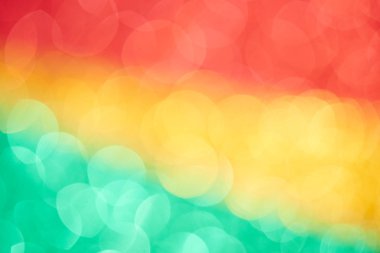 Yeşil sarı kırmızı bokeh efekti soyut arka plan. Renkli daireler reggae rasta arka planı, Jamaika deseni