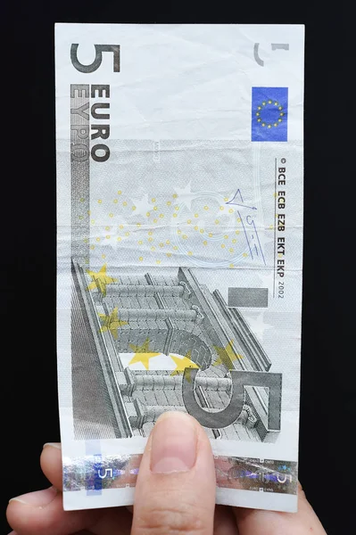 Five euro in hand — Stock Photo, Image