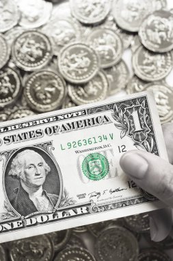 Arka plan için bir dolla ve altın sikkeler 