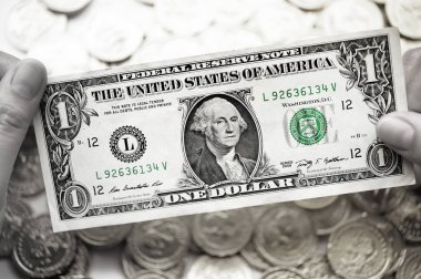 Arka plan için bir dolla ve altın sikkeler