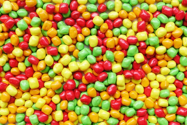 五颜六色的糖果，为背景的 — 图库照片