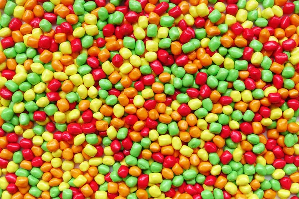 Kolorowe cukierki, tło — Zdjęcie stockowe