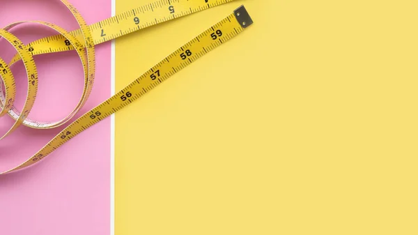 Close Measure Tape Pink Yellow Background — Stock Photo, Image