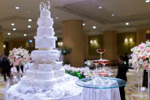Champagne tower and in wedding cake.