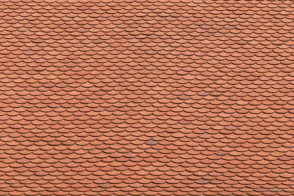 Red tiles roof background texture.