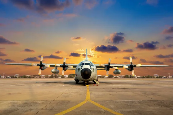 Military aircraft on the runway during sunset. — Stock Photo, Image