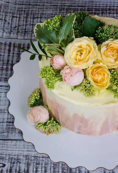 stock image ombre wedding cake decorated with roses and some greenery