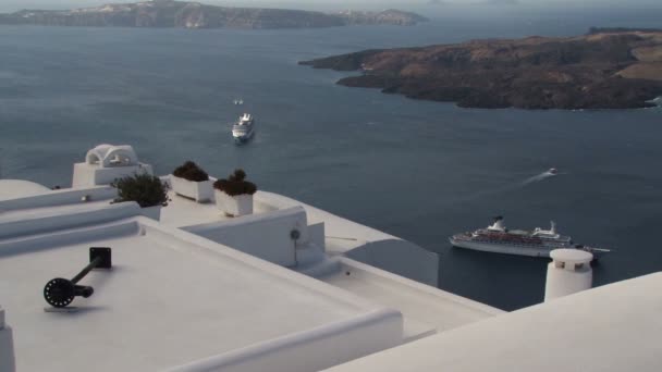 View overlooking the rooftops of Fira Santorini to the caldera. — Stock Video