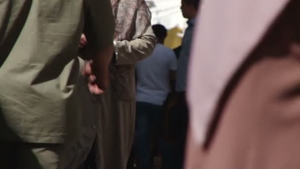 Close waist level view of shoppers in the Medina of Tripoli, — Stock Video