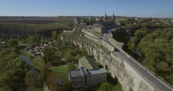 Aerial camera flies sideways past Kamianets-Podilsk castle — Stock Video