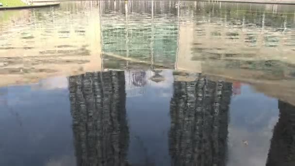 Reflection of Petronas Towers in water feature below — Stock Video