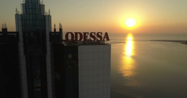 Drone Flies Back Odessa Hotel Sunrise Showing Massive Odessa Sign — Stock Video