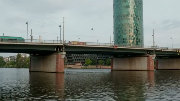 Camera Tilts Friedensbrucke Westhafen Tower Dawn Tram Crosses Bridge — Stock Video